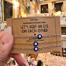 Load image into Gallery viewer, Silver evil eye matching bracelets on a Let's Keep An Eye On Each Other card - Let's Jam, Camden Market