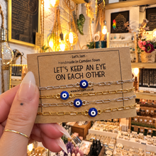 Load image into Gallery viewer, Gold and silver evil eye matching bracelets on a Let's Keep An Eye On Each Other card - Let's Jam, Camden Town London