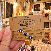 Load image into Gallery viewer, Gold evil eye matching bracelets on a Let's Keep An Eye On Each Other card - Let's Jam, Camden Market
