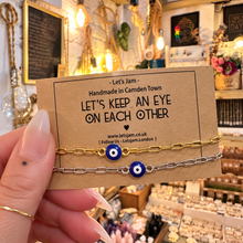 Load image into Gallery viewer, Gold and silver evil eye matching bracelets on a Let's Keep An Eye On Each Other card - Let's Jam, Camden Market London