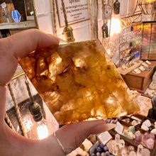 Load image into Gallery viewer, Side view of the fire quartz point standing on its wooden base - Let's Jam, Camden Town