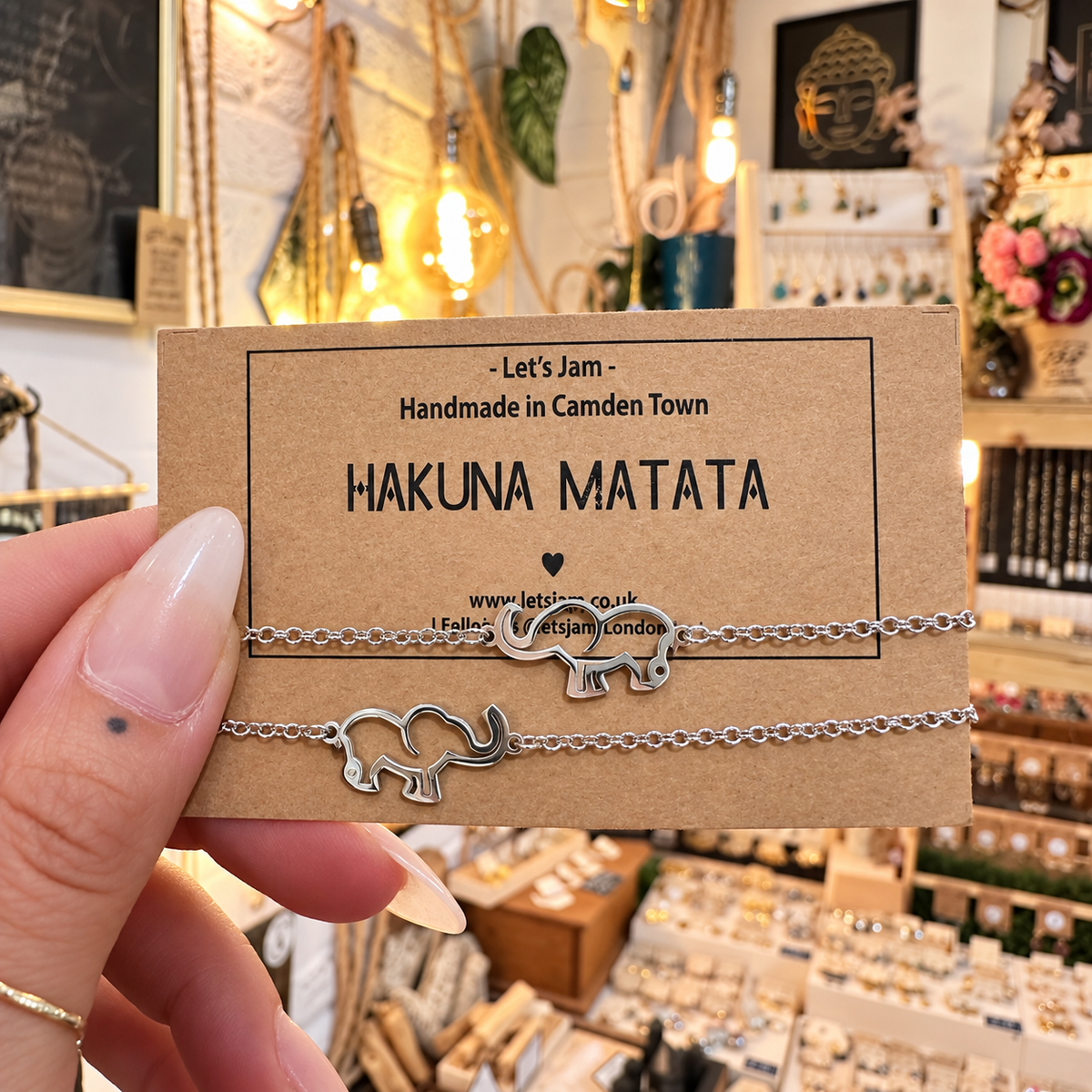 Two silver chain bracelets with elephant charms on a Let's Jam "Hakuna Matata" card - Let's Jam, Camden Market, London