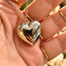 Load image into Gallery viewer, Silver puffed heart locket held in the hand - Let's Jam, Camden Town London