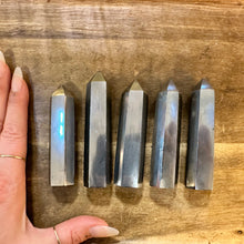 Load image into Gallery viewer, Five hematite crystal towers next to a hand to show their size - Let's Jam, Camden Market London