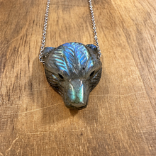 Load image into Gallery viewer, Carved labradorite bear head flashing blue on a wooden surface - Let's Jam jewellery, Camden Town