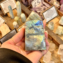 Load image into Gallery viewer, Flat face of the labradorite obelisk showing its natural lines and flash - Let's Jam, Camden Market