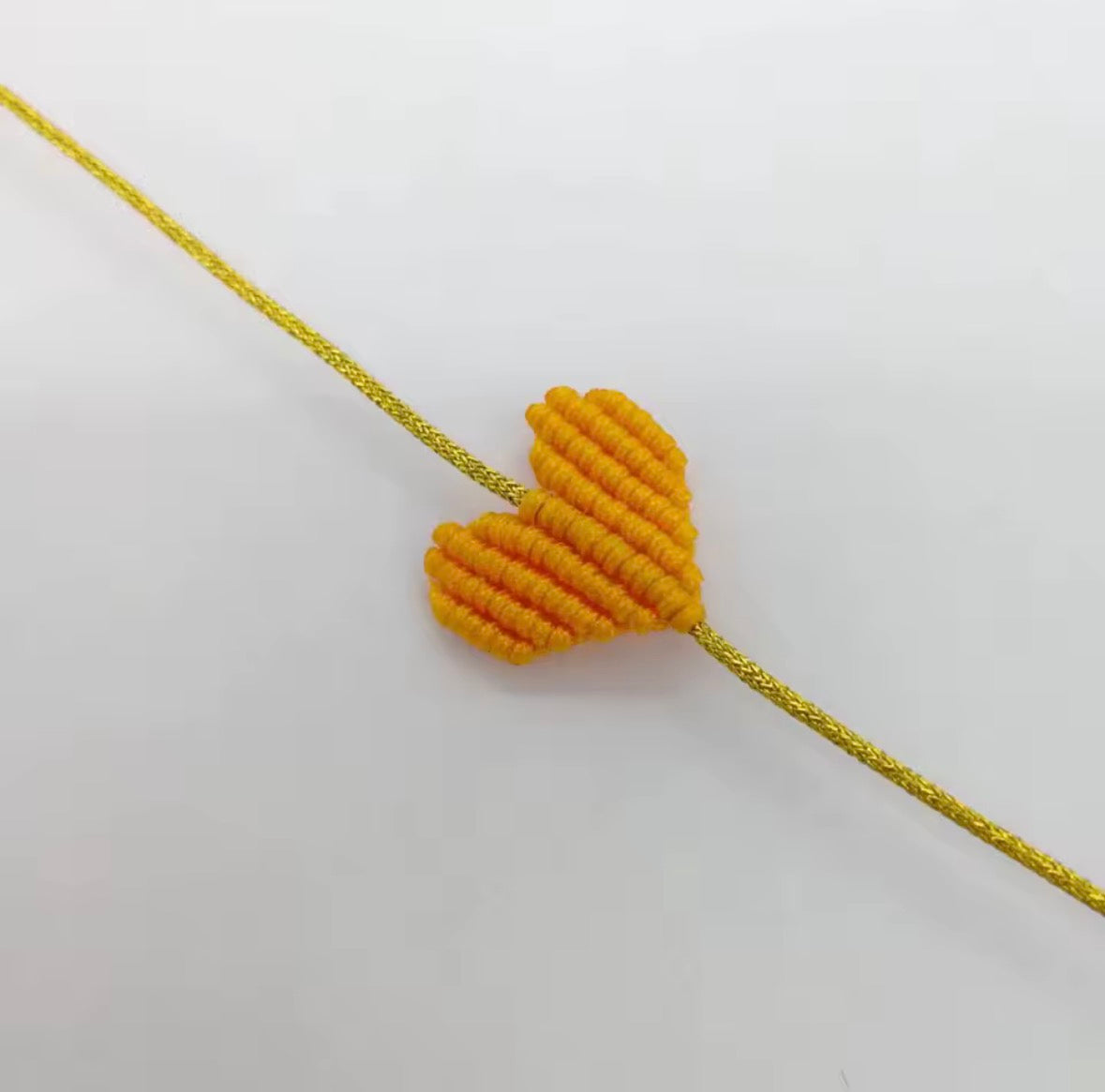 Mustard yellow macramé heart bracelet on a gold cord - Let's Jam, Camden Market