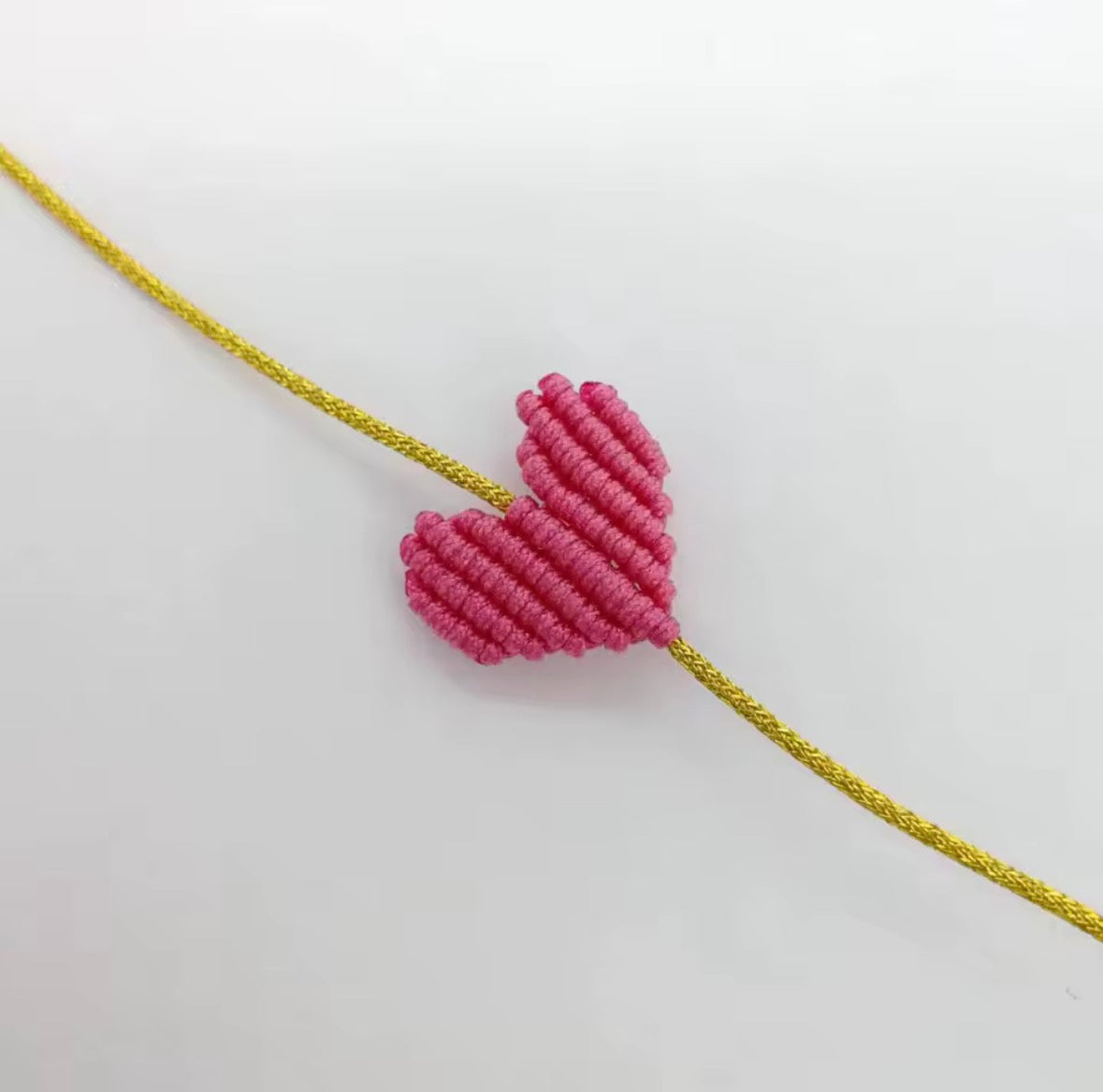 Pink macramé heart bracelet on a gold cord - Let's Jam, Camden Town London