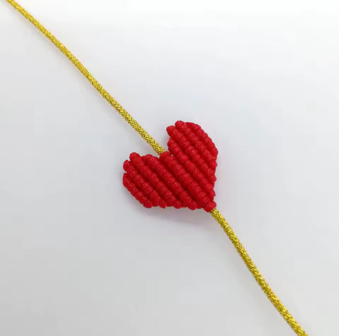 Red macramé heart bracelet on a gold cord - Let's Jam, Camden Market London