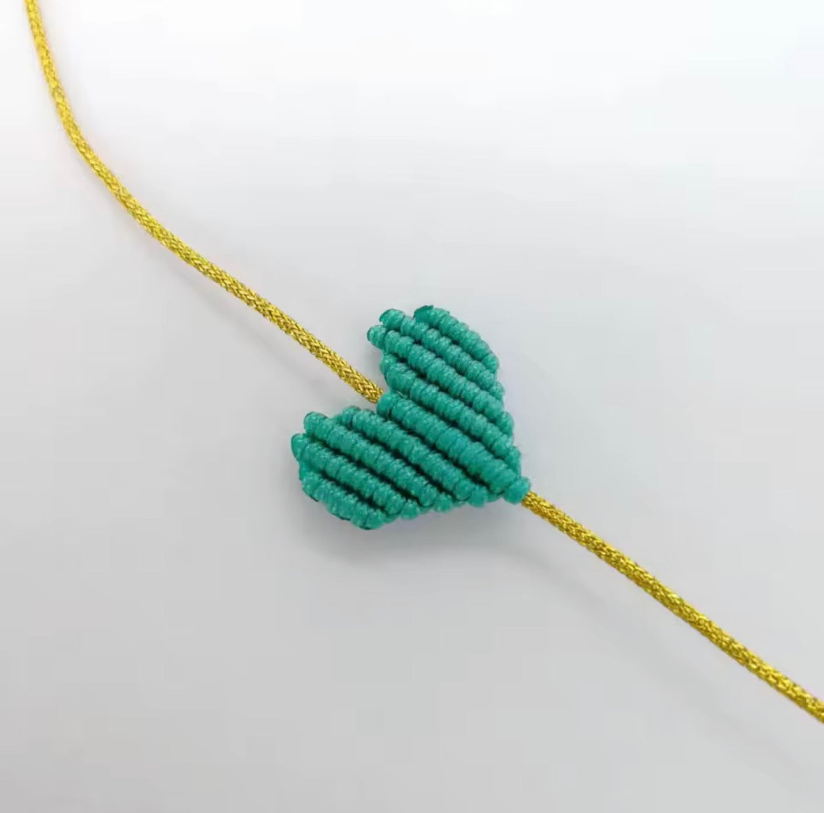 Teal macramé heart bracelet on a gold cord - Let's Jam, Camden Market London