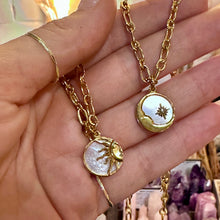 Load image into Gallery viewer, Sun and moon mother of pearl pendants on gold chains held in the hand - Let's Jam, Camden Market, London