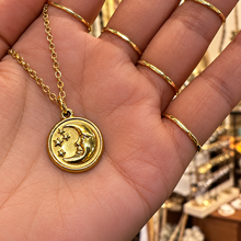 Load image into Gallery viewer, Gold round moon face medal held in the hand - Let's Jam jewellery, Camden Market London