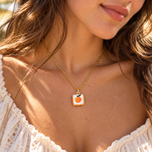 Load image into Gallery viewer, Hand painted orange ceramic necklace worn with a white top - Let's Jam, Camden Market London