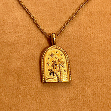 Load image into Gallery viewer, Gold arch pendant with a palm tree, sun and stars on a chain - Let's Jam, Camden Market