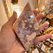 Load image into Gallery viewer, Pink amethyst held in the hand to show its size - Let's Jam, Camden Market, London