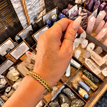Load image into Gallery viewer, Gold plaited chevron cuff worn on the wrist - Let's Jam, Camden Market, London