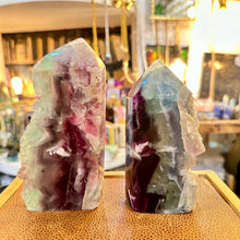Load image into Gallery viewer, Rainbow fluorite towers turned to show their green and purple banding - Let's Jam, Camden Market London