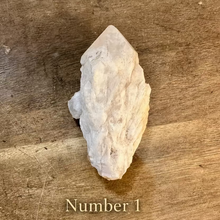 Load image into Gallery viewer, Raw milky quartz point number one on a wooden table - Let's Jam, Camden Town London