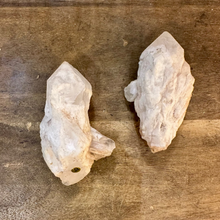 Load image into Gallery viewer, Two raw milky quartz points side by side on a wooden table - Let's Jam, Camden Market