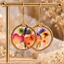Load image into Gallery viewer, Hammered gold frame earrings with real rose petals and colourful pressed flowers on a gold stand - Let's Jam jewellery, Camden Town