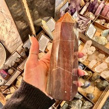 Load image into Gallery viewer, Side view of the red jasper point showing its polished faces - Let's Jam, Camden Market London