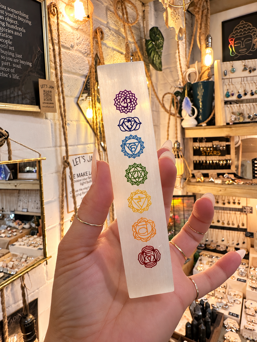 Selenite chakra charging stick, a polished white bar with the seven chakra symbols - Let's Jam, Camden Town