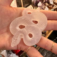 Load image into Gallery viewer, Selenite snake held in the hand to show its length - Let's Jam, Camden Market, London
