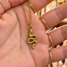 Load image into Gallery viewer, Sleek gold snake necklace resting across the palm - Let's Jam, Camden Town London
