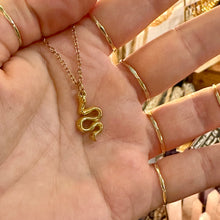 Load image into Gallery viewer, Gold snake pendant necklace held in the hand - Let's Jam, Camden Market