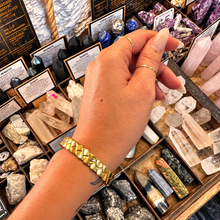 Load image into Gallery viewer, Gold squared plait cuff worn on the wrist - Let's Jam, Camden Market, London