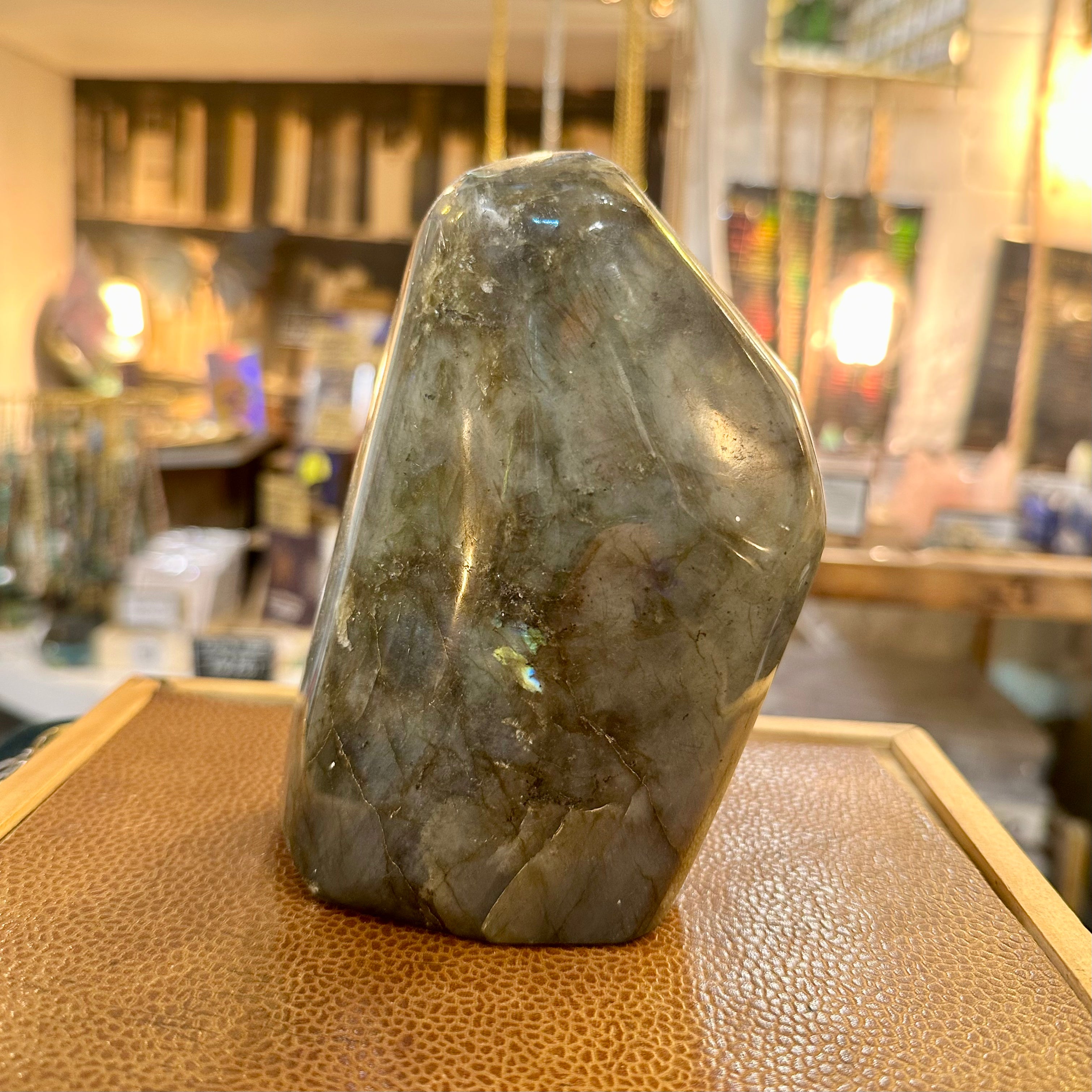 Supersized polished labradorite freeform on the shop counter - Let's Jam, Camden Market