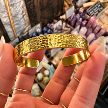 Load image into Gallery viewer, Front of the textured gold cuff held up - Let's Jam, Camden Town London