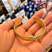 Load image into Gallery viewer, Thick plait gold cuff laid open in the palm - Let's Jam, Camden Market, London