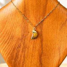 Load image into Gallery viewer, Gold chain necklace with a tiger's eye pendant displayed on a wooden neck bust - Let's Jam jewellery, Camden Town