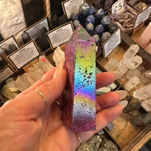 Load image into Gallery viewer, Rainbow flash across the titanium quartz obelisk as it catches the light - Let's Jam, Camden Town