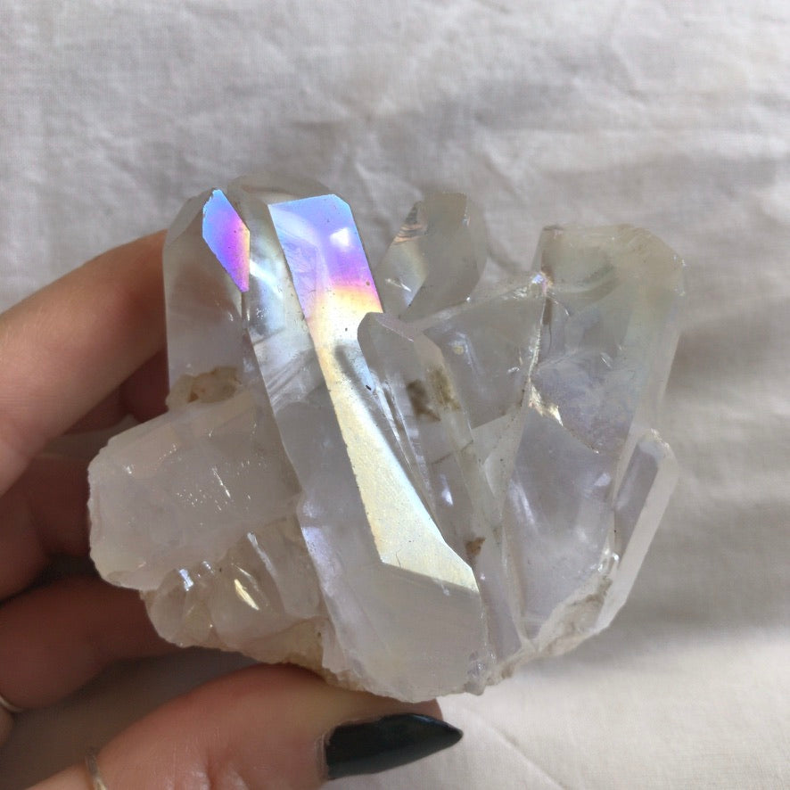 Close view of the angel aura quartz showing pink and blue iridescence - Let's Jam, Camden Town