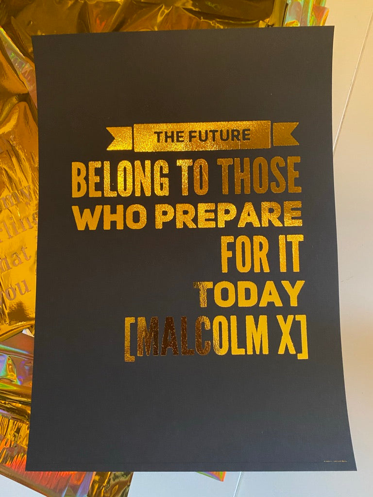 Malcolm X quote wall art shown in a gold frame - Let's Jam poster prints, Camden Market London