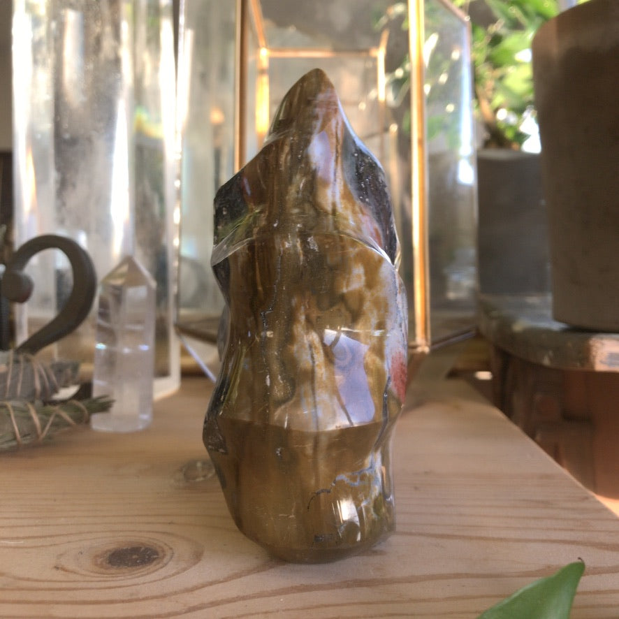 Brazilian jasper point standing upright, colours shifting from red to green - Let's Jam crystals, Camden Market London
