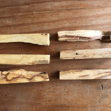 Load image into Gallery viewer, Palo santo sticks resting together on a flat surface - Let's Jam smudge shop, Camden Town