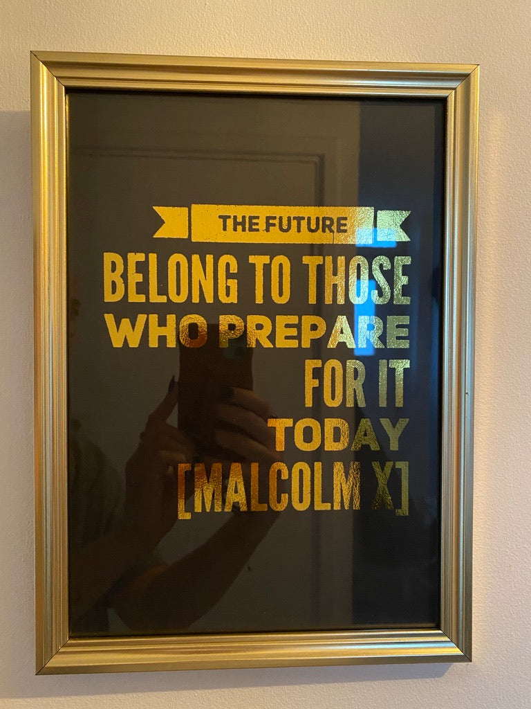 Close view of the holographic text on the Malcolm X quote print - Let's Jam, Camden Town