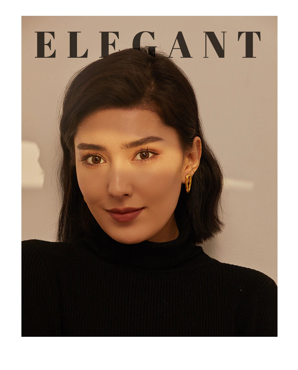 Small polished hoops worn on both ears, front-facing portrait - Let's Jam jewellery, Camden Market, London