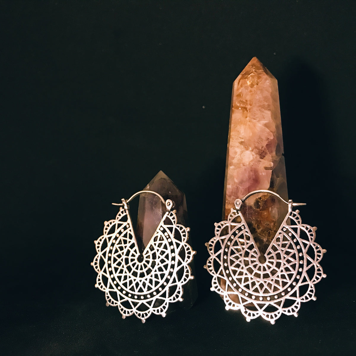 Silver filigree lace medallion earrings with intricate crochet-like openwork, displayed with natural crystal points - Let's Jam jewellery collection