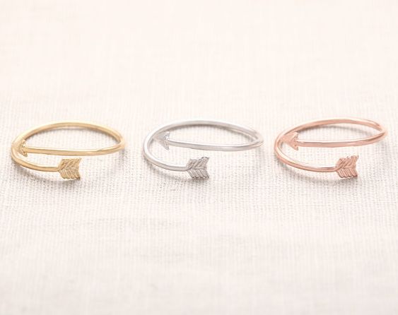 Minimal arrow ring with a feathered tail wrapping the finger - Let's Jam jewellery, Camden Market