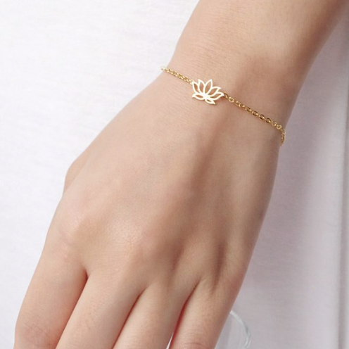 Lotus flower bracelet worn on the wrist, charm facing up - Let's Jam jewellery, Camden Town