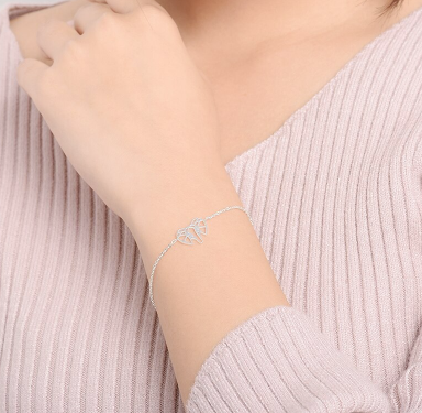 Minimal elephant bracelet coiled to show chain and clasp - Let's Jam jewellery, Camden Market