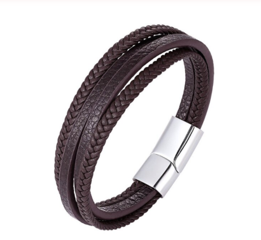 Close-up of the gunmetal magnetic clasp on a black plaited leather bracelet - Let's Jam jewellery, Camden Market