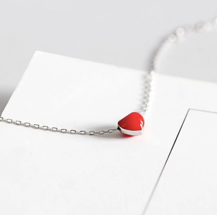 Two red heart necklaces layered together to show both chain lengths - Let's Jam jewellery, Camden Market, London