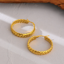 Load image into Gallery viewer, Chunky hoop earring catching the light along its polished curve - Let's Jam jewellery, Camden Market, London