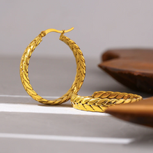Load image into Gallery viewer, Three-quarter portrait of a model in thick gold-plated hoop earrings - Let's Jam, Camden Market London