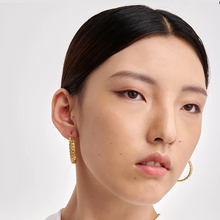 Load image into Gallery viewer, Chunky gold-plated stainless steel hoop earrings shown as a pair - Let's Jam jewellery, Camden Market London